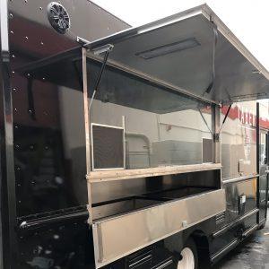 Exterior of Taber burger food truck with open serving window