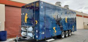 Exterior of Pinecrest Summer Camp catering trailer with wrap