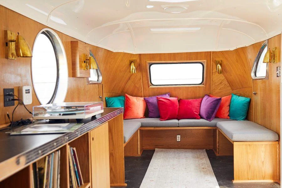 Interior of Snapchat's custom vintage trailer lounge with banquette seating