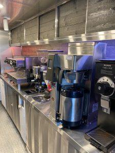 Interior of Ohm Coffee truck with commercial espresso equipment