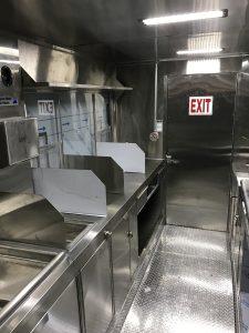 Interior of Meadowlark burger truck with serving window and countertop