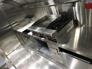 Interior of Meadowlark Burger truck with cooking equipment