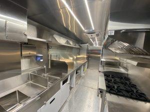 Interior of Capuchin Order food truck sink and cabinets
