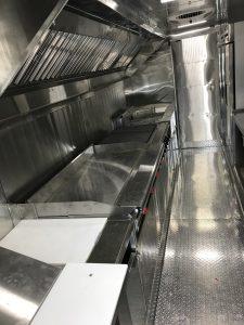 Interior of crepe food truck with kitchen equipment