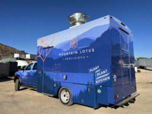 Driver's side of Mountain Lotus Provisions catering truck wrap