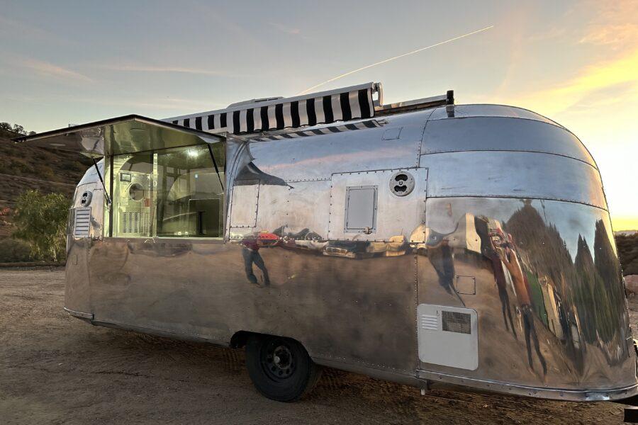 Exterior of Oh Neil's Ice Cream custom airstream trailer with open serving door