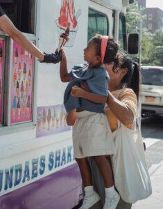 Mother and daughter at an ice cream truck