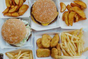Classic burgers, fries and chicken nuggets in to-go containers