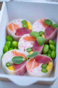 Cut sushi rolls with a sprinkle of edamame beans