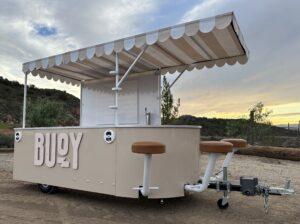 Front of Buoy custom experiential marketing trailer with trailer tongue attached