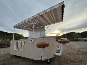 Front of of Buoy experiential marketing vehicle at sunset