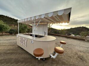 Buoy customized marketing trailer with awning and barstools