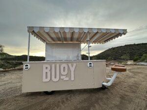 Front of of Buoy experiential marketing vehicle at sunset