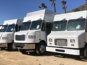 Row of new trucks ready to be converted into Firefly food trucks